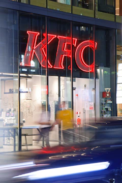 A busy KFC outlet with customers lining up for their favorite meals.