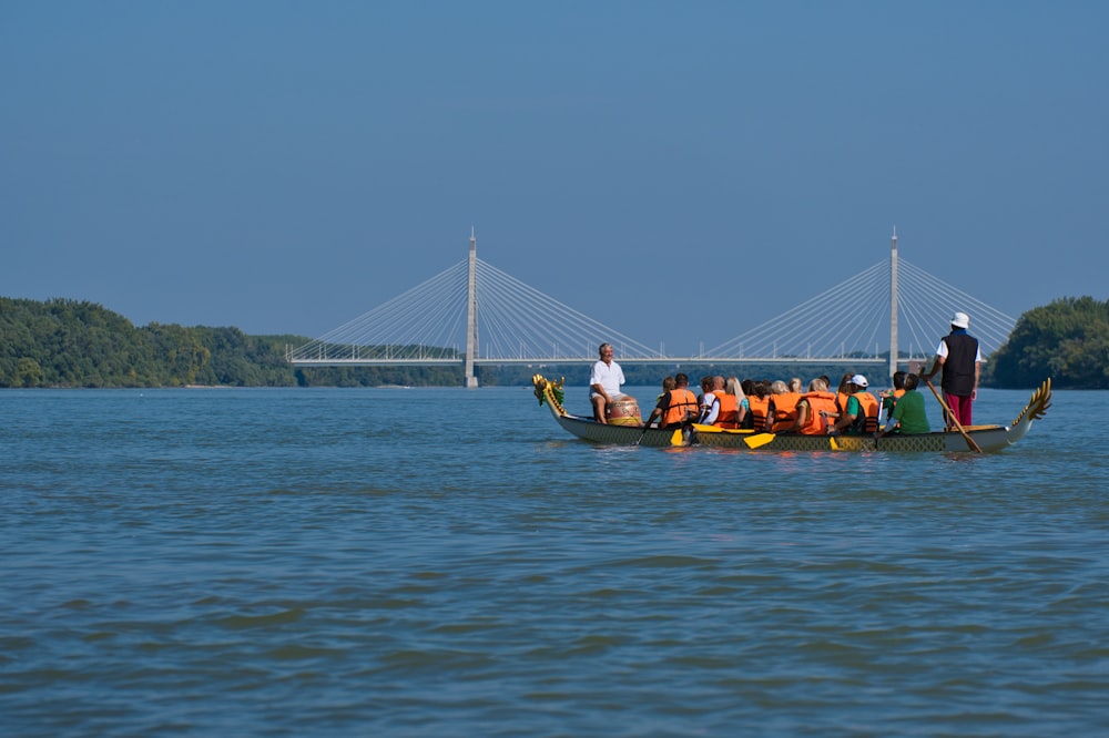 a group of people riding on the back of a boat