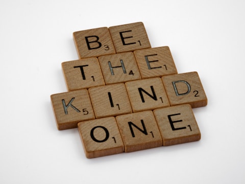 a scrabble of words that spell out be the kind of kind of one