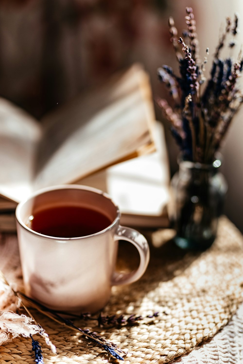 a cup of tea and a book on a table