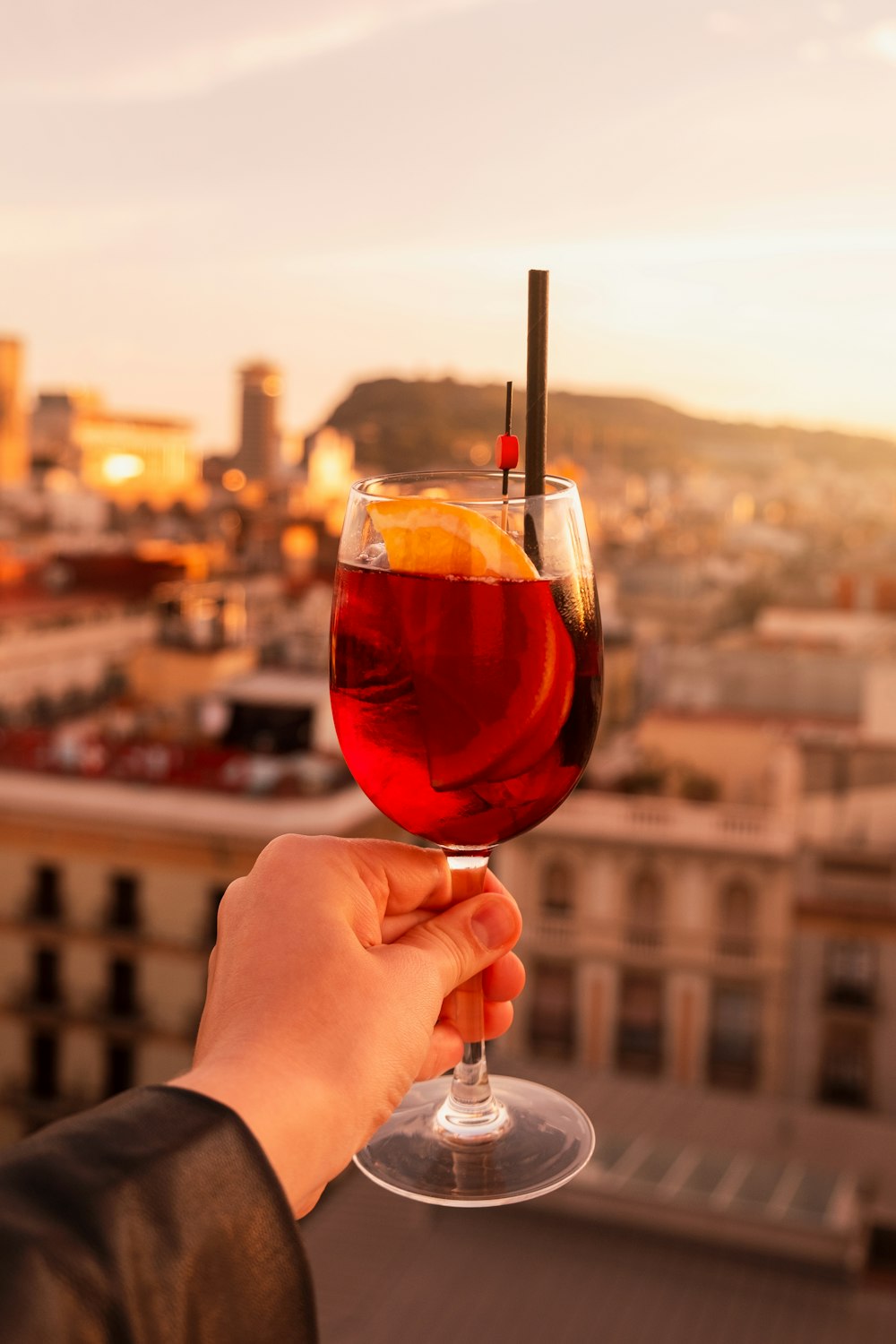 a person holding a wine glass