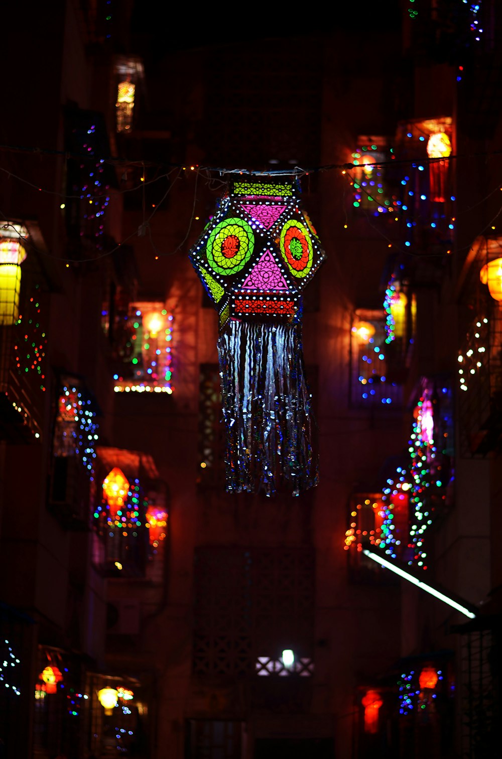 a brightly lit room with a skull hanging from the ceiling