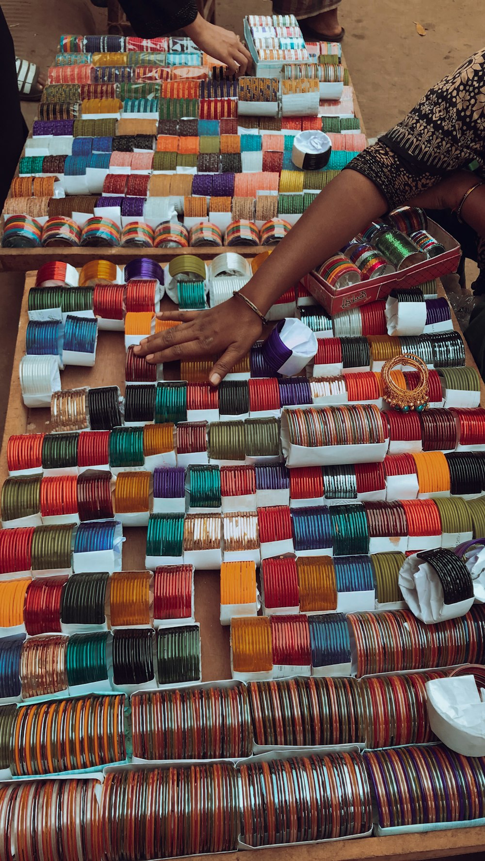 a table topped with lots of different types of bracelets