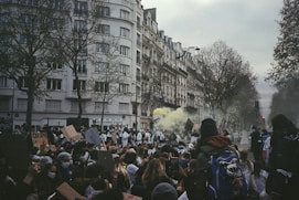 a crowd of people standing in front of a building