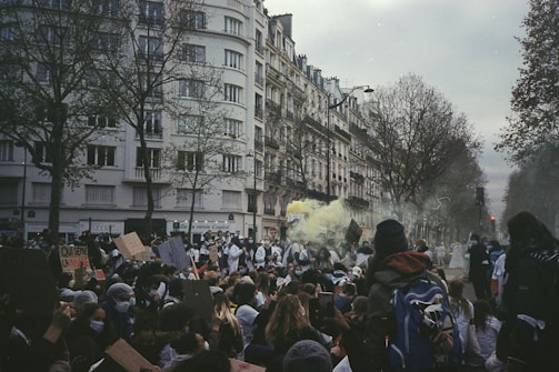a crowd of people standing in front of a building