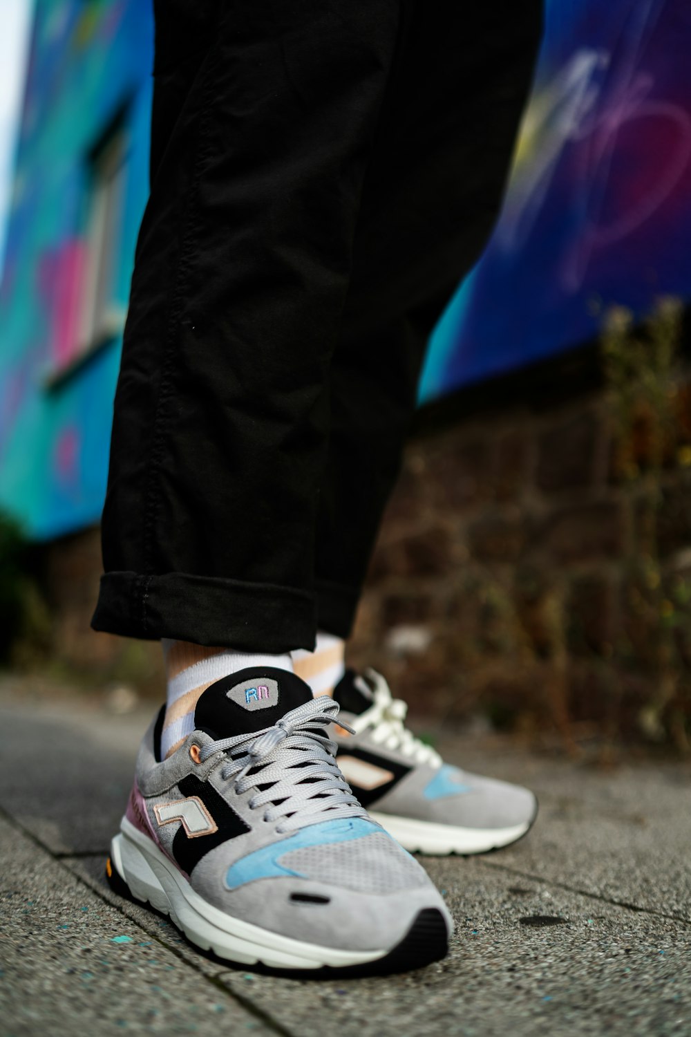 a close up of a person's shoes on the ground