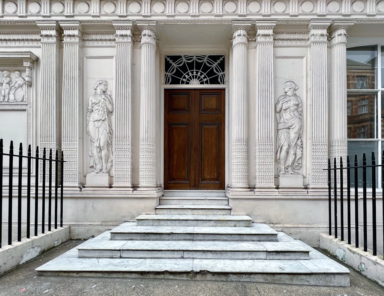 Entrance and steps of a classical building on Wigmore Street, Marylebone, London