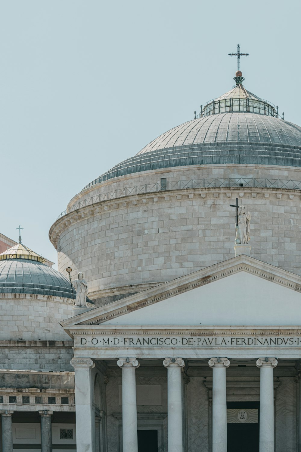 a large building with a cross on top of it