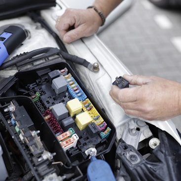 a man is working on a car's engine