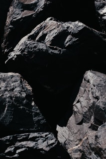 a close up of rocks with a black background