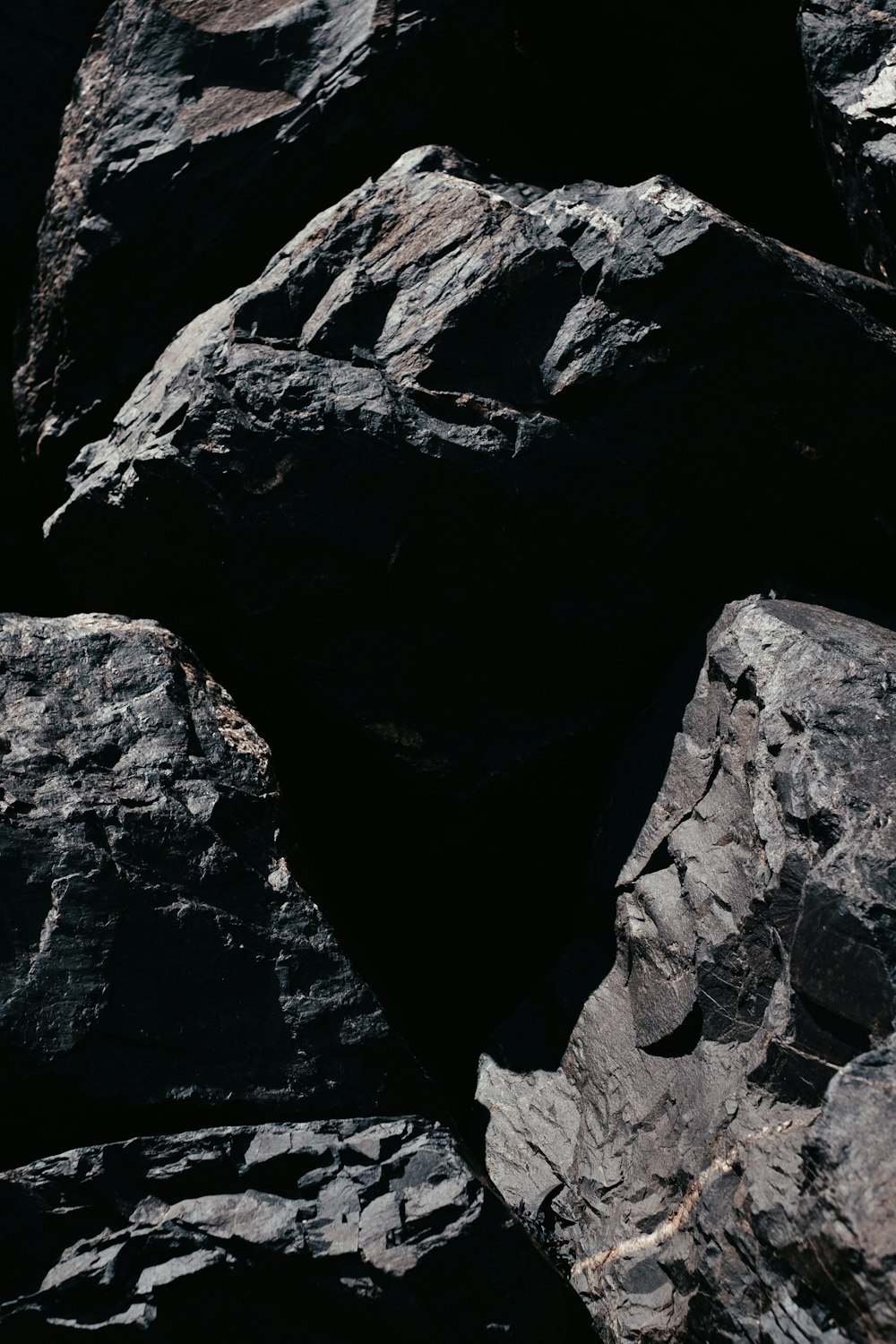 a close up of rocks with a black background