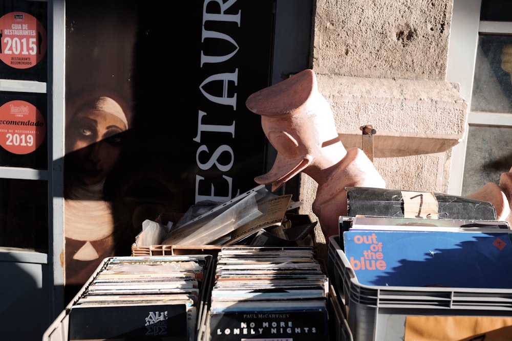 a pile of records sitting on top of a table