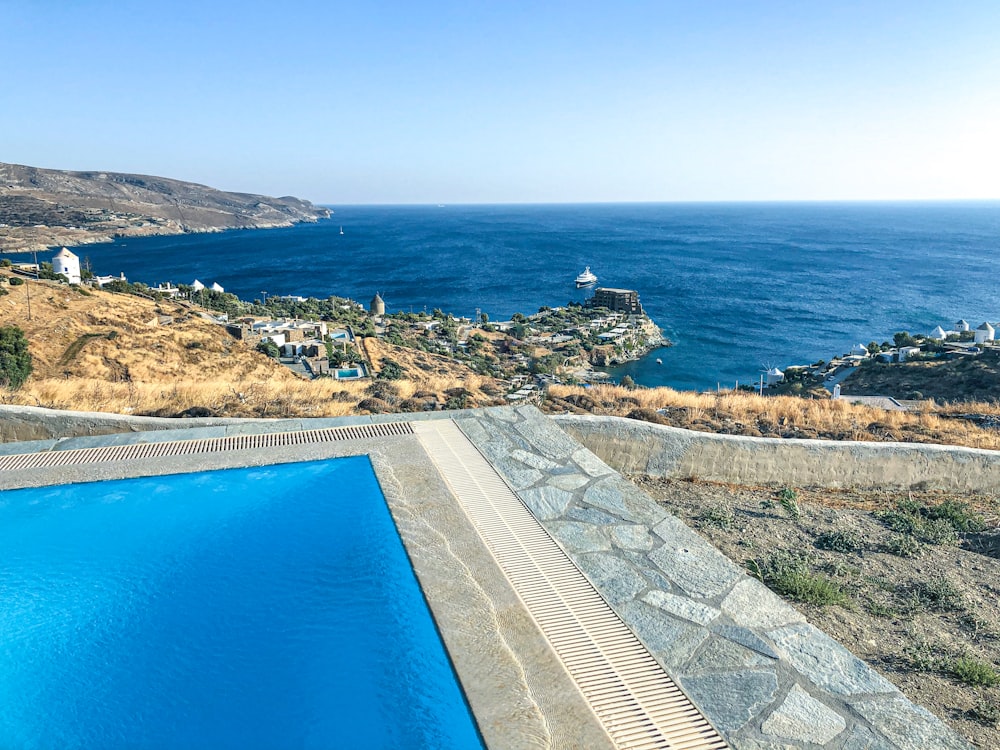 a swimming pool with a view of the ocean