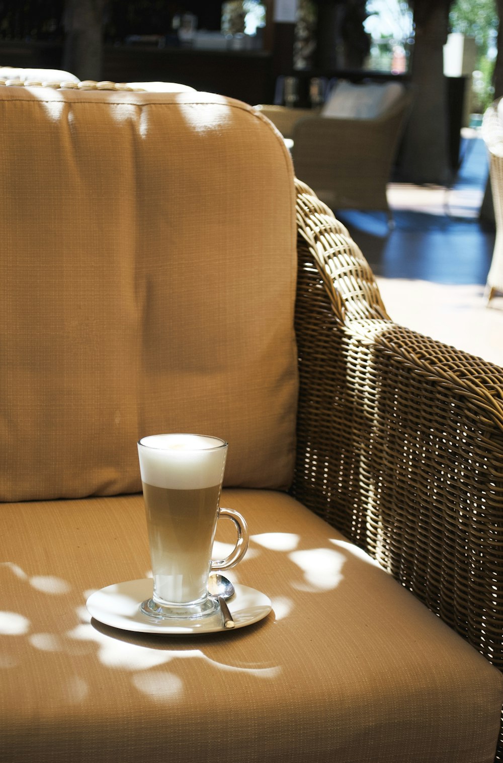 a cup of coffee sitting on top of a table