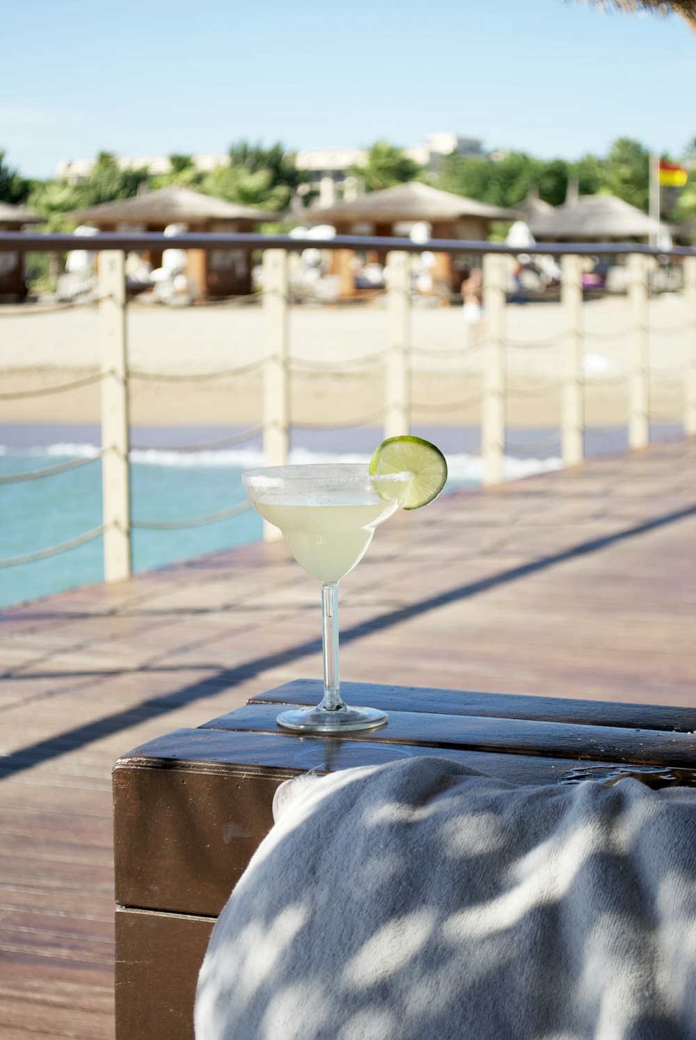 a margarita sitting on top of a wooden table