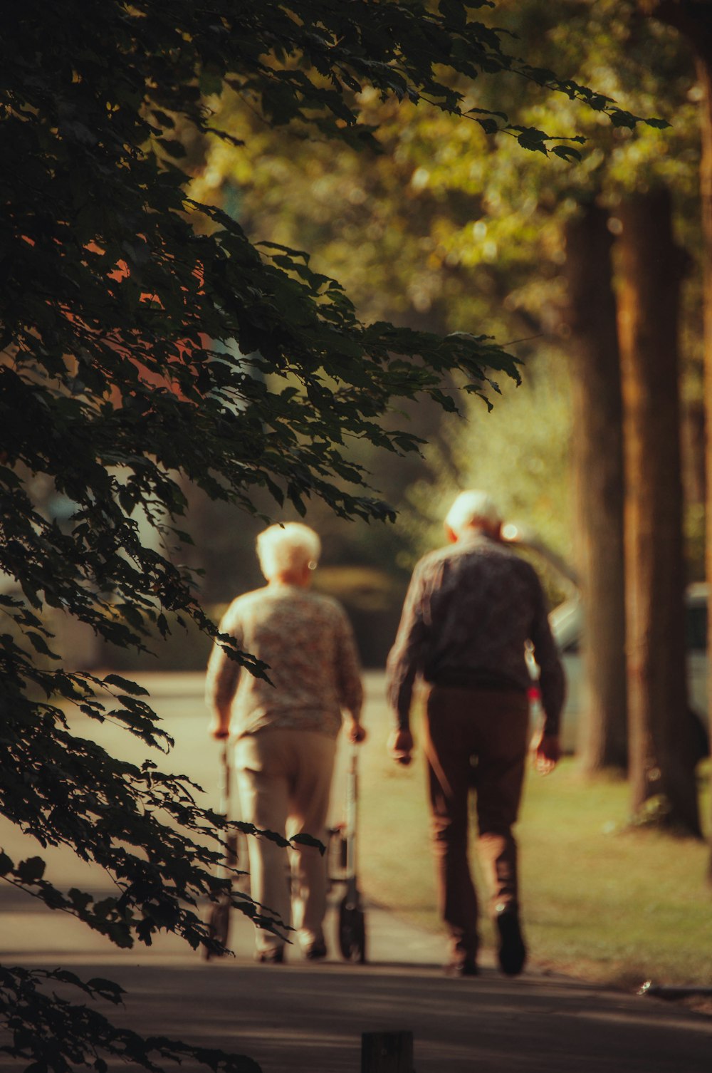 a man and a woman walking down a sidewalk