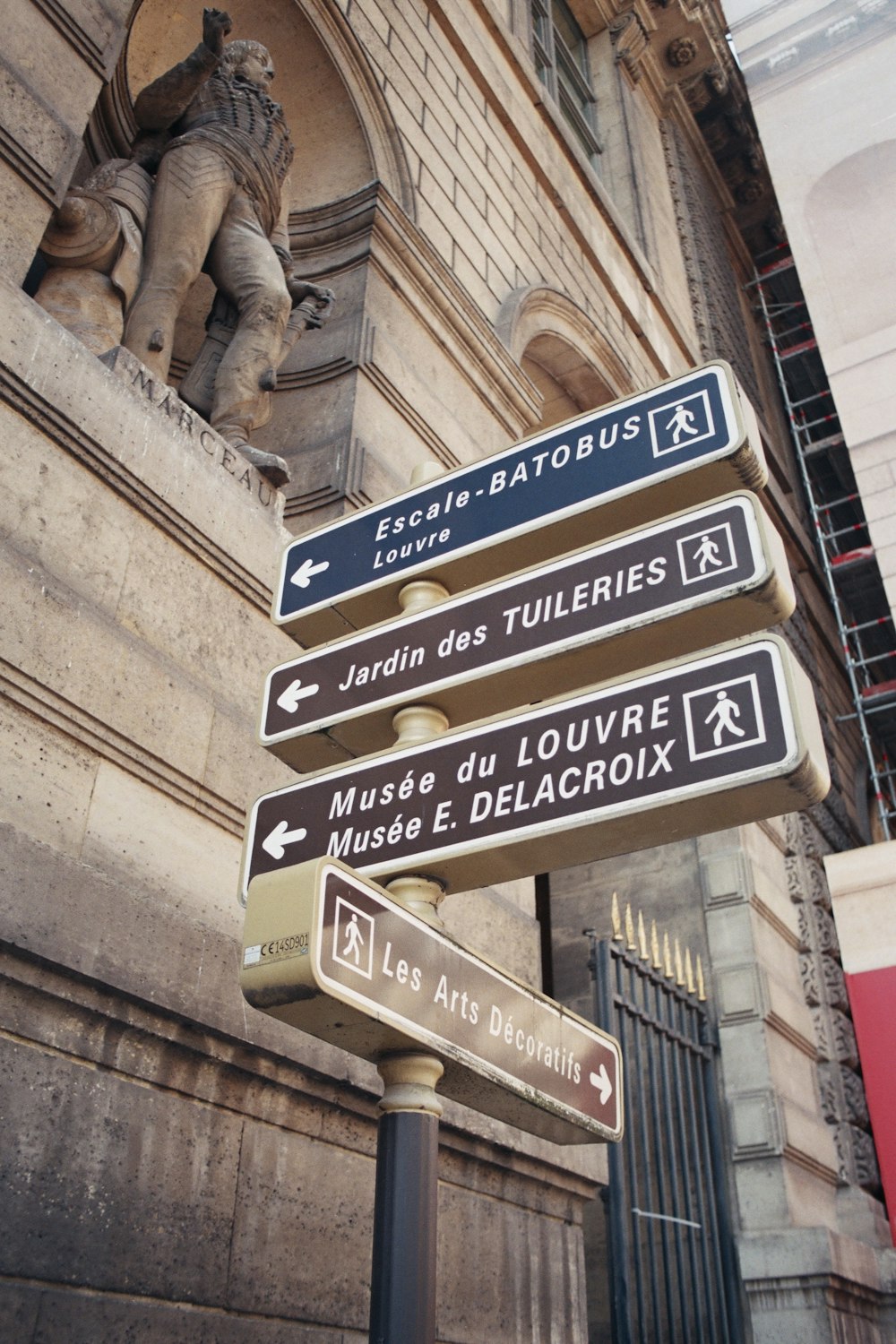 a street sign on a pole in front of a building