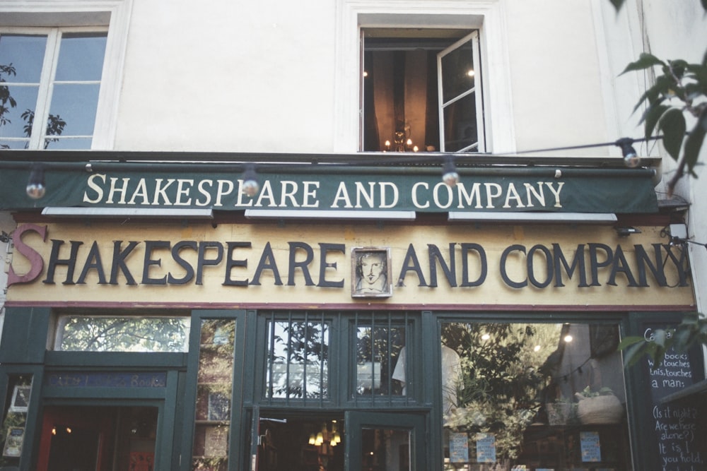 a shakespeare and company sign above a doorway