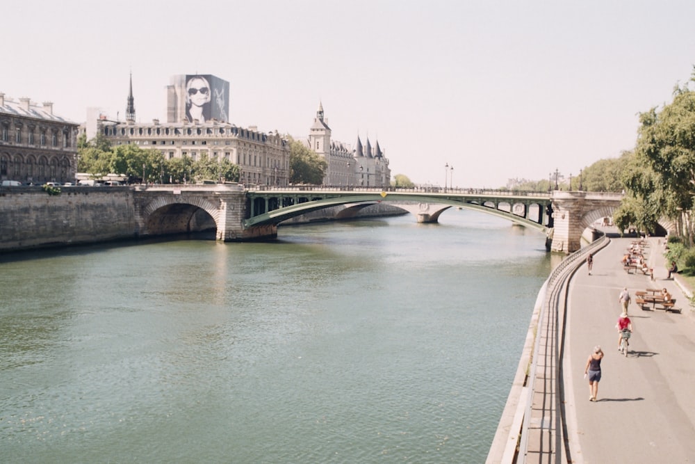 a river running through a city with a bridge over it