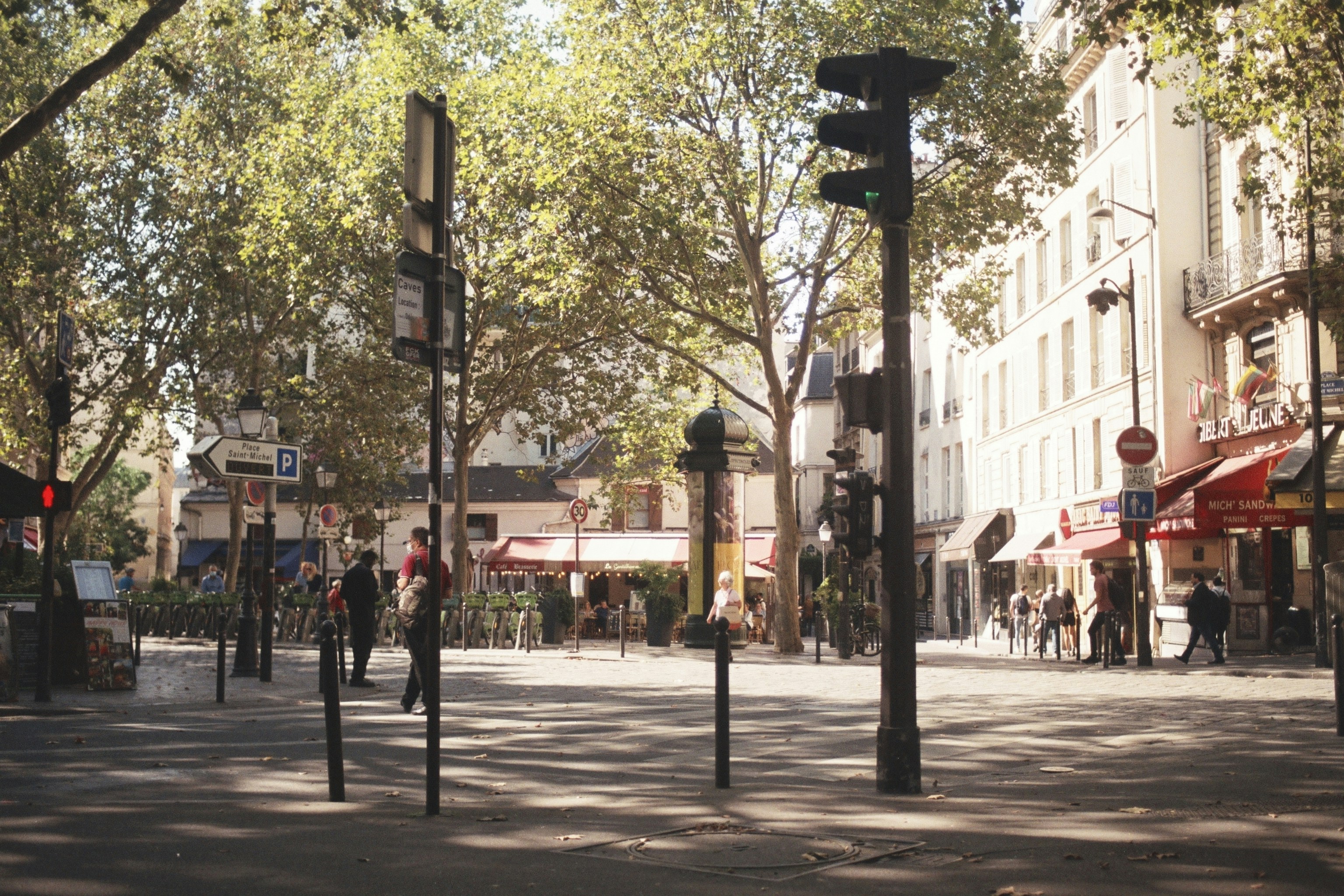 a group of people walking down a street next to tall buildings, Paris on 35mm Film!</p><p>Nikon FE2</p><p>Fujifilm Fujicolor C200</p><p>All photos were taken by me.