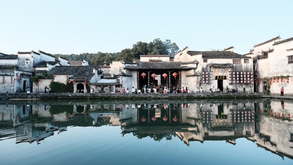 a body of water surrounded by buildings and trees