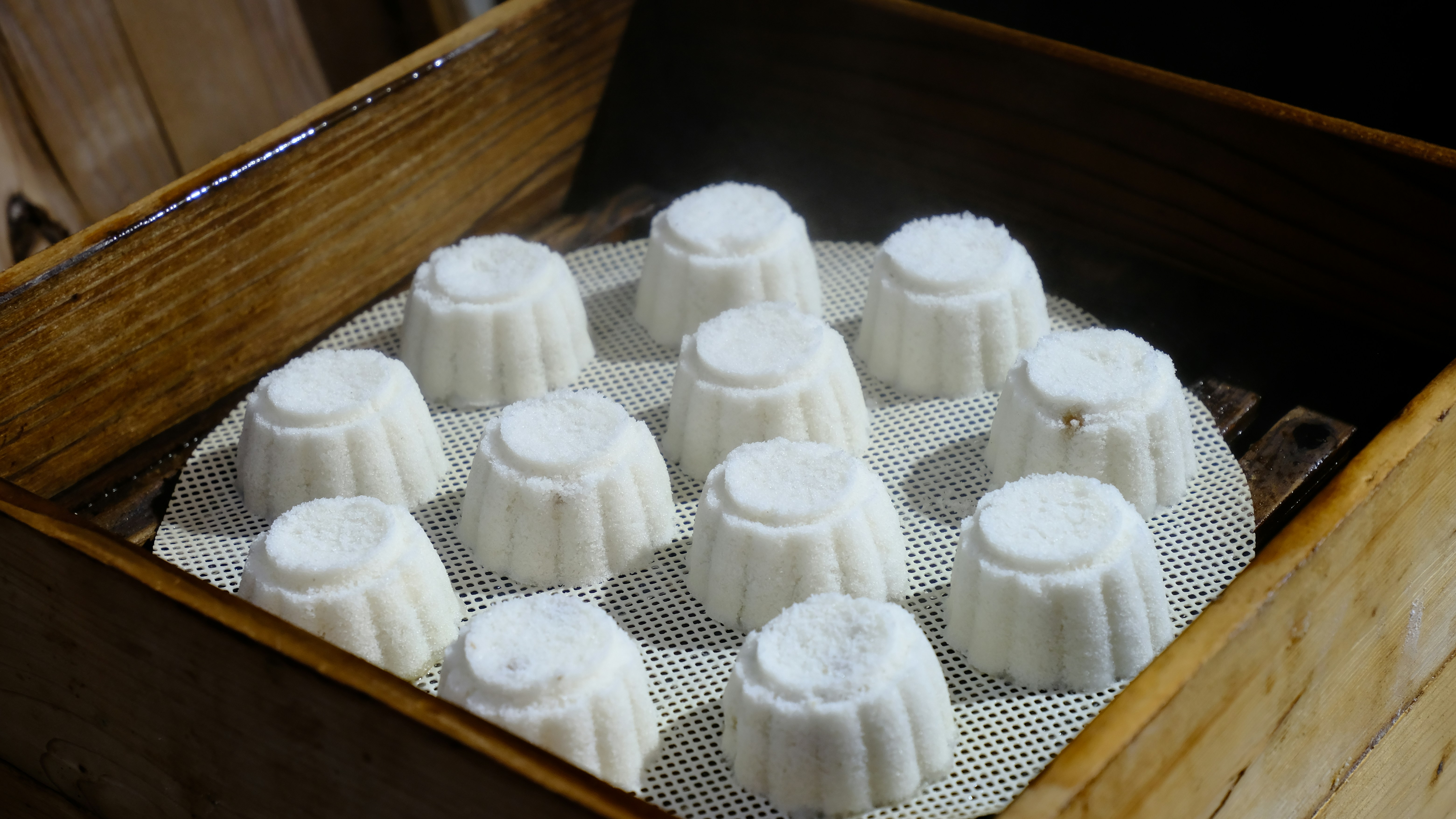 Wooden box filled with white cakes