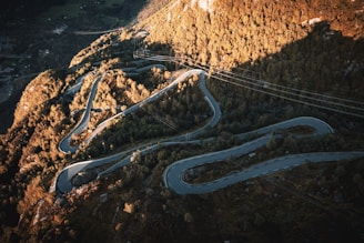 an aerial view of a winding mountain road
