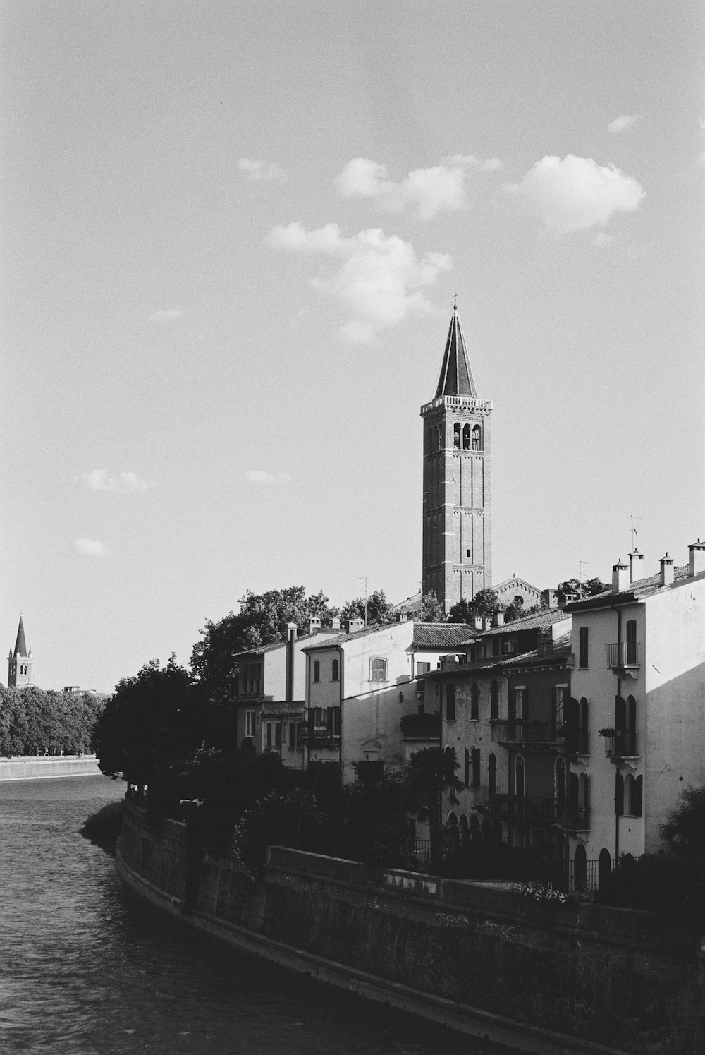 a black and white photo of a clock tower