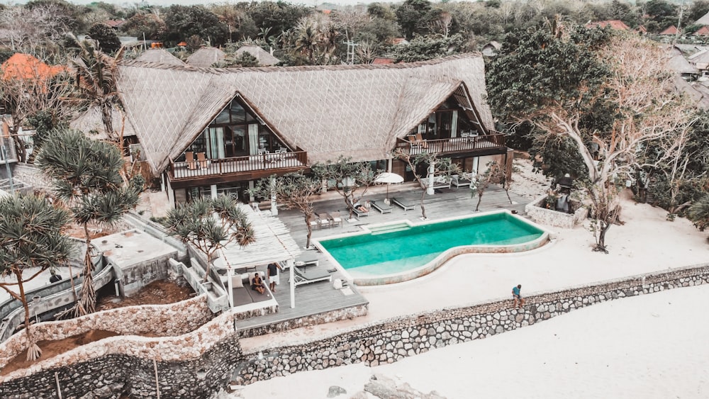 an aerial view of a house with a swimming pool
