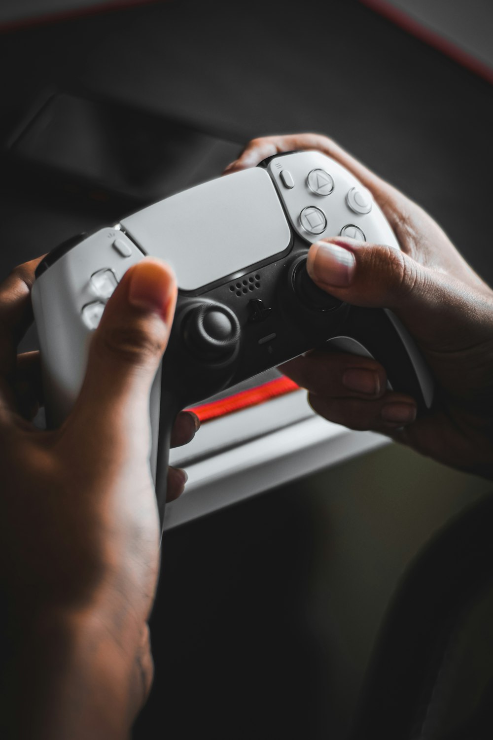 a person holding a video game controller in their hands