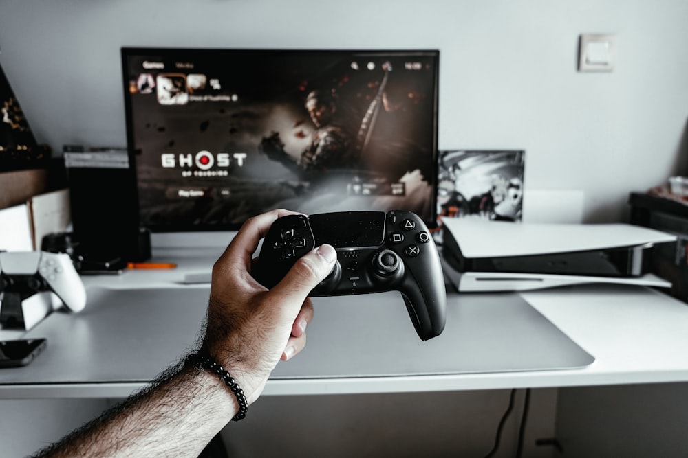 Free Photo  Person playing video games with controller on