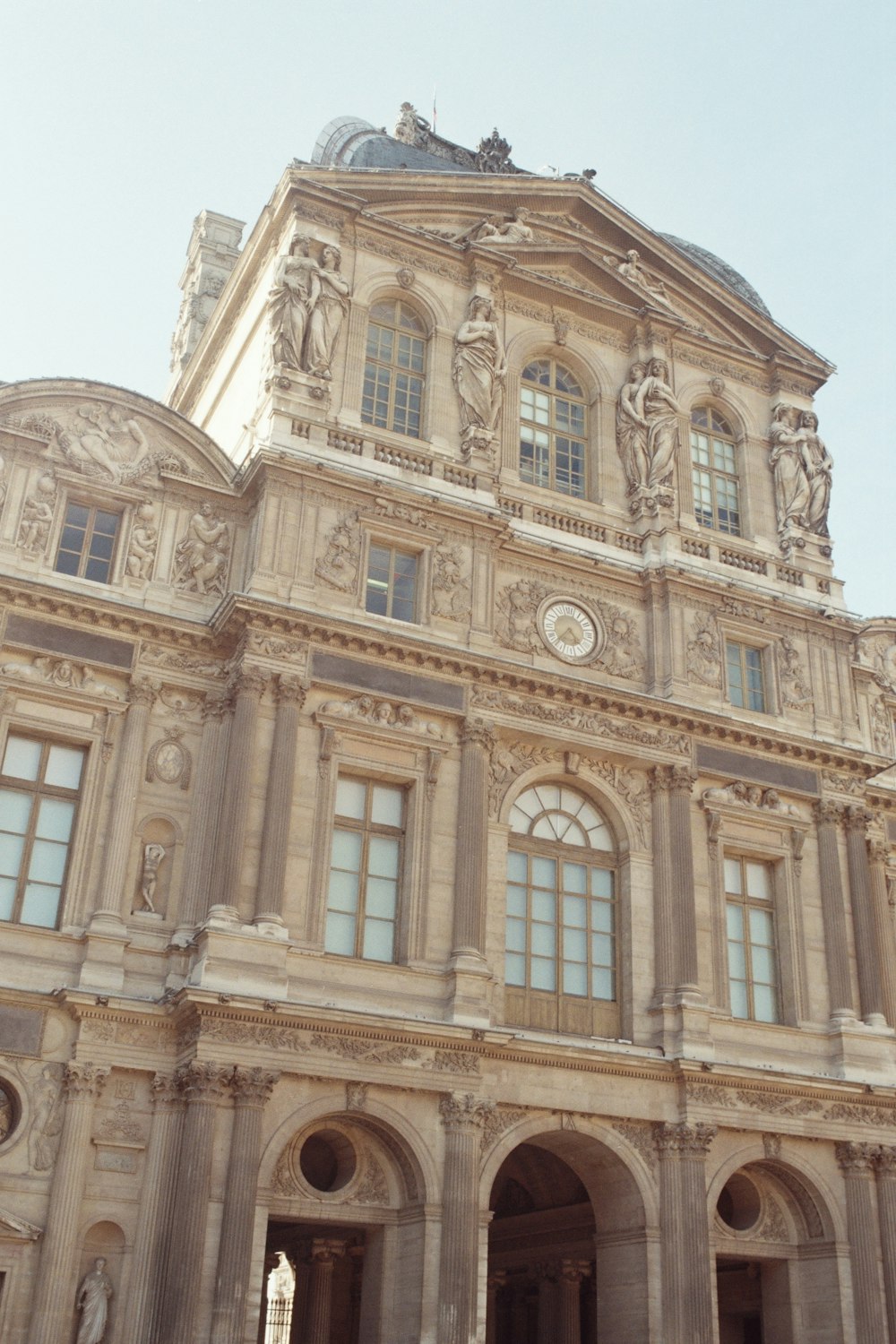 a large building with a clock on the front of it