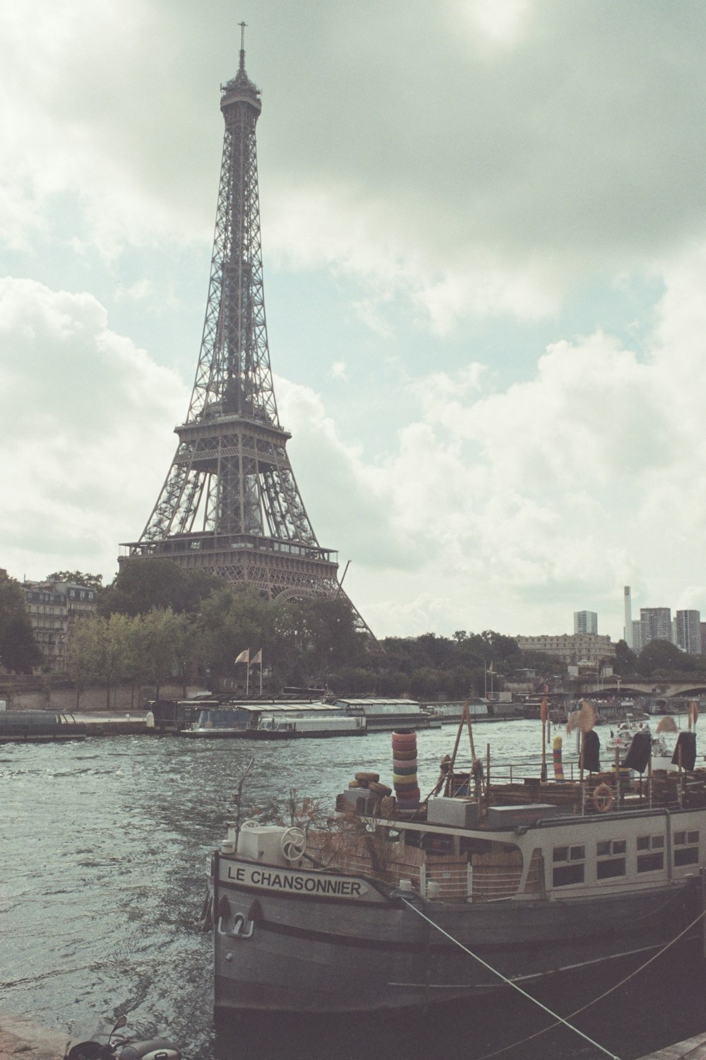 a boat is docked in front of the eiffel tower