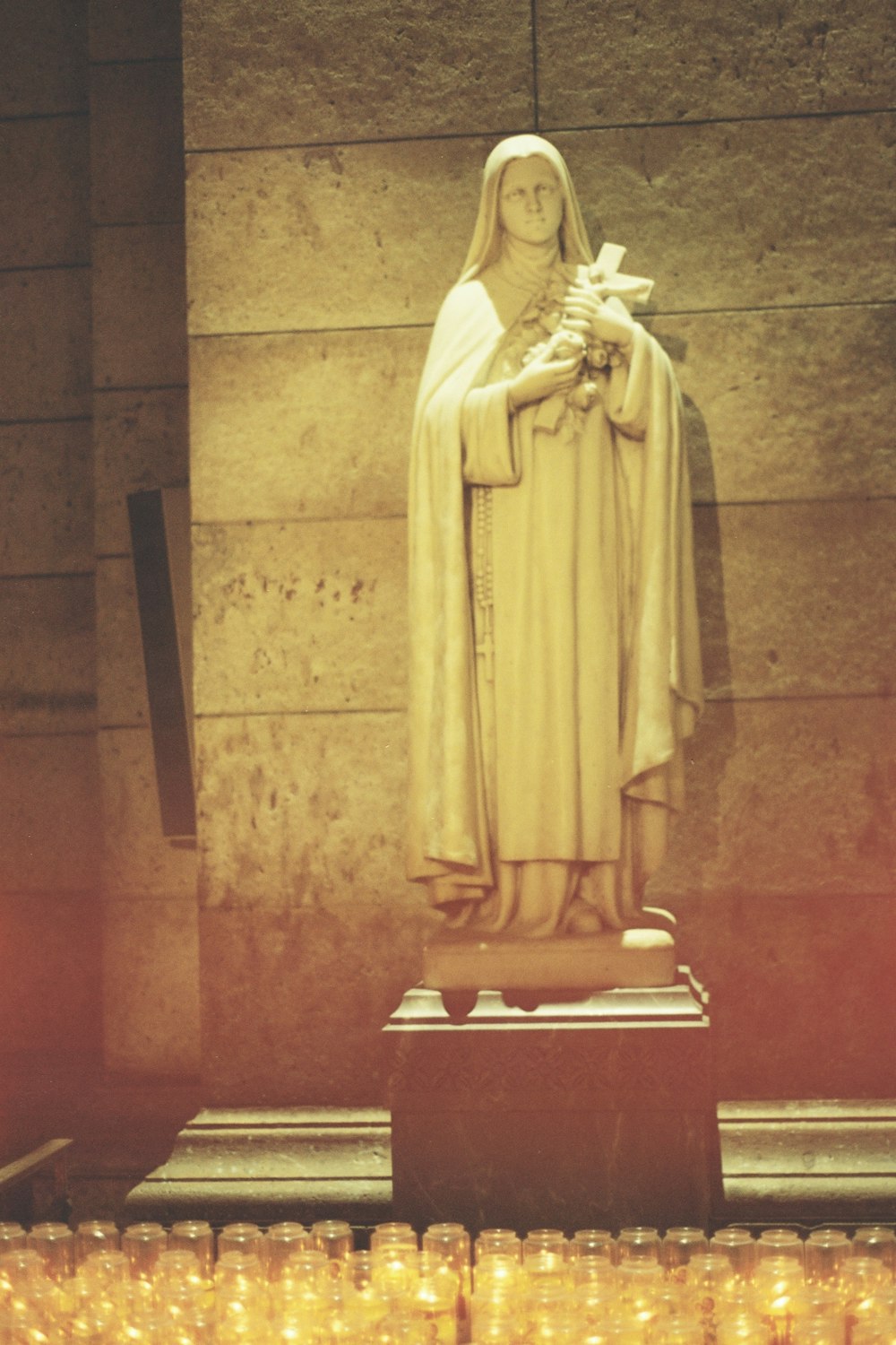 a statue of the virgin mary in a church