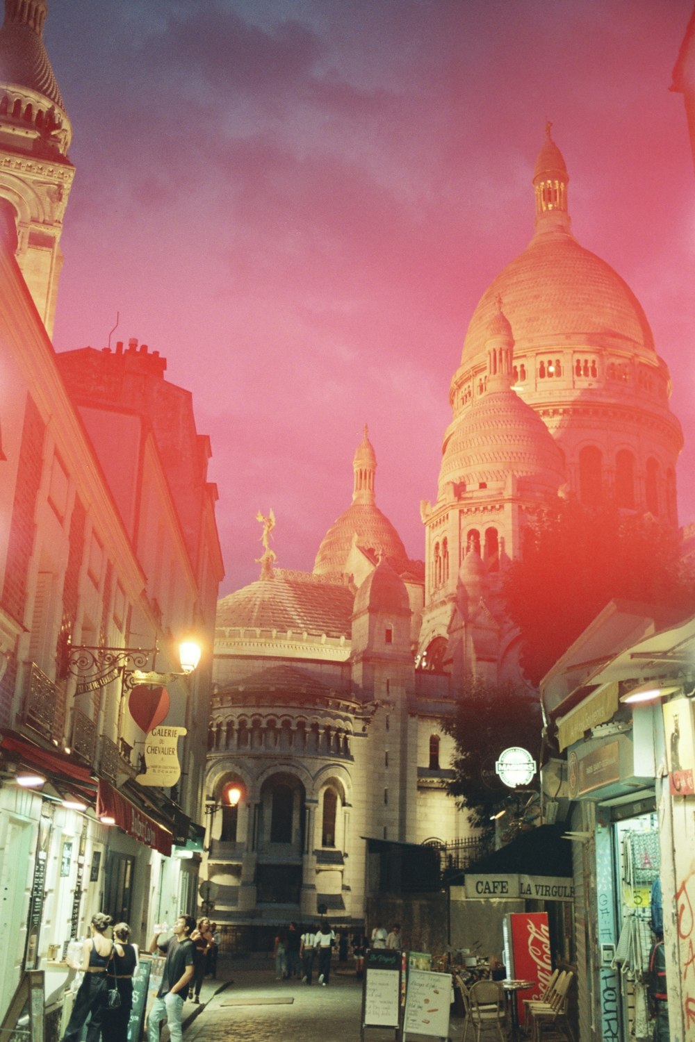 a picture of a city street with a building in the background