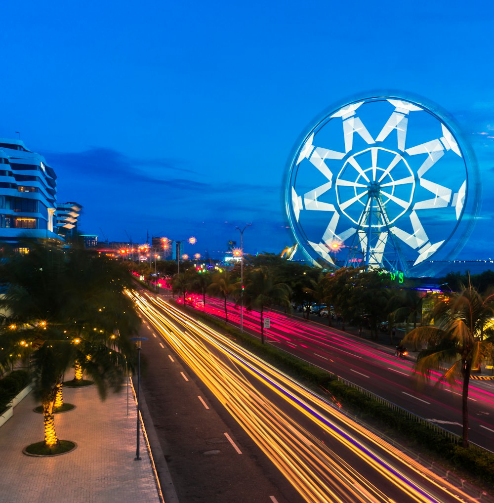 a view of a ferris wheel at night