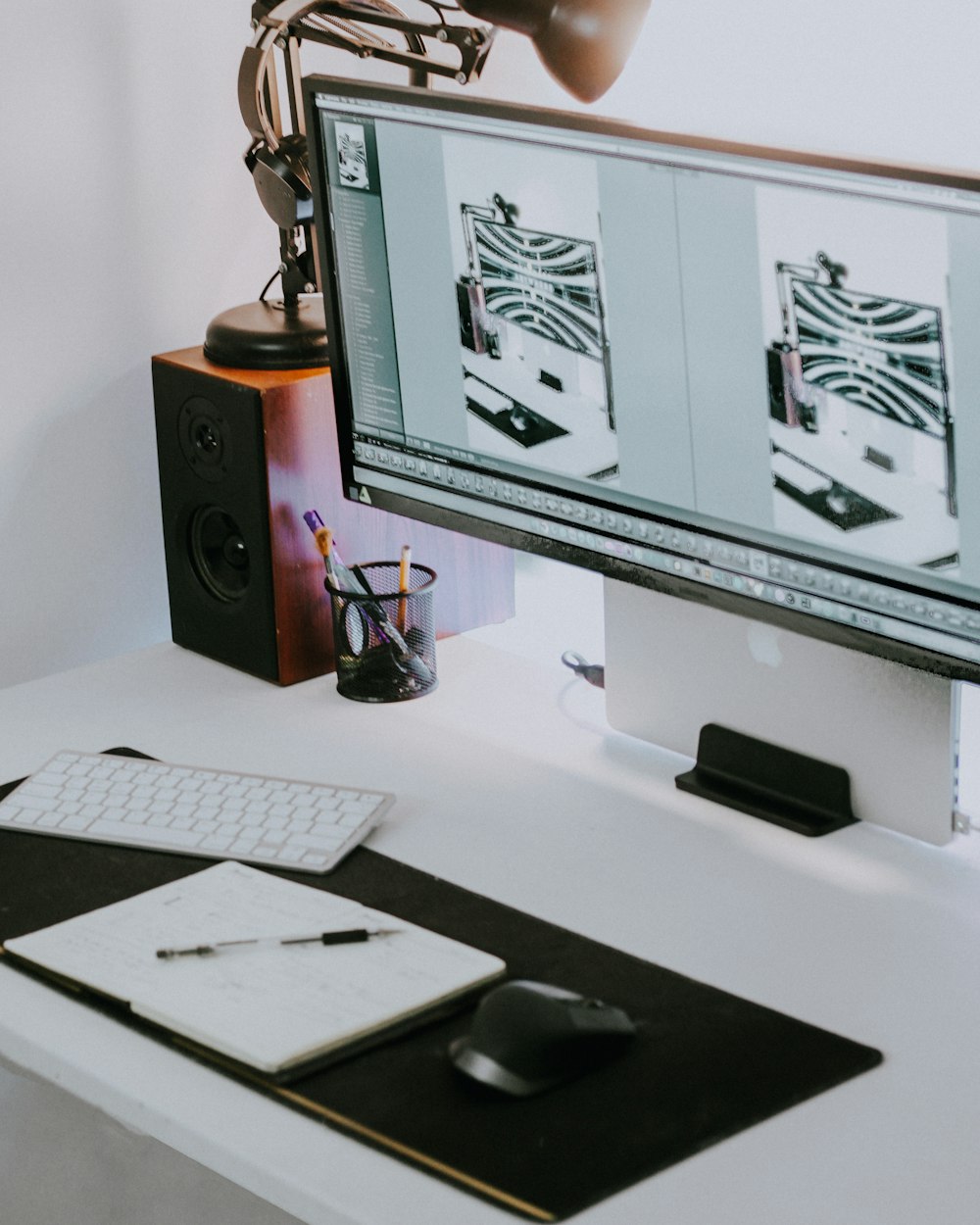 a computer monitor sitting on top of a white desk