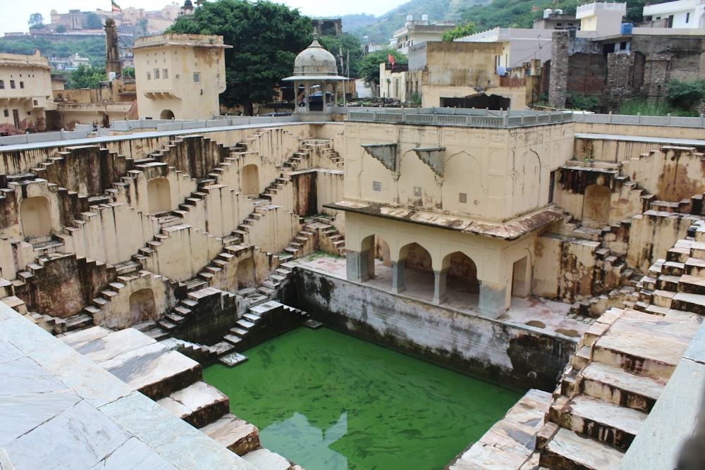 a green pool in the middle of a building