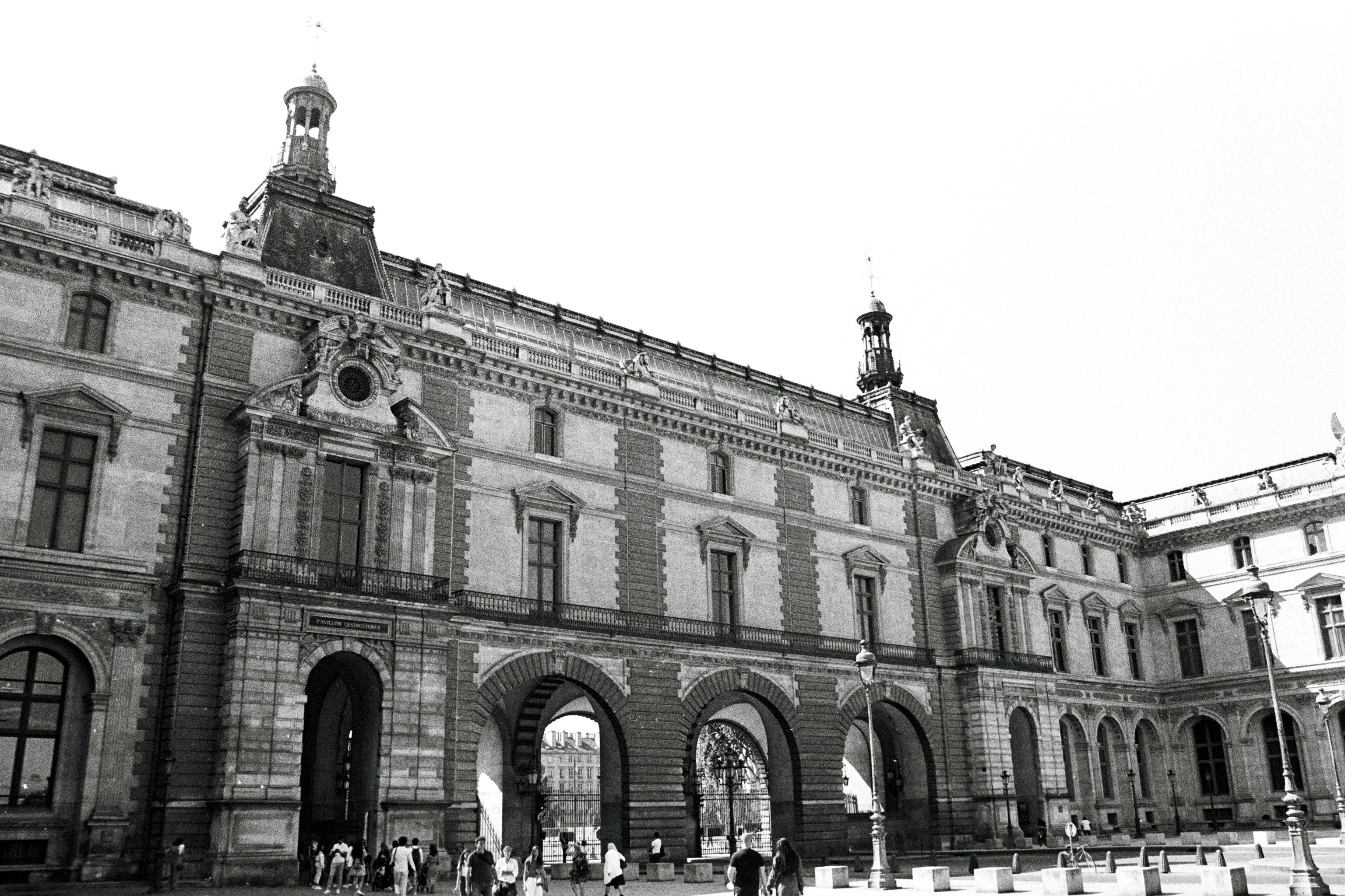 a black and white photo of a large building