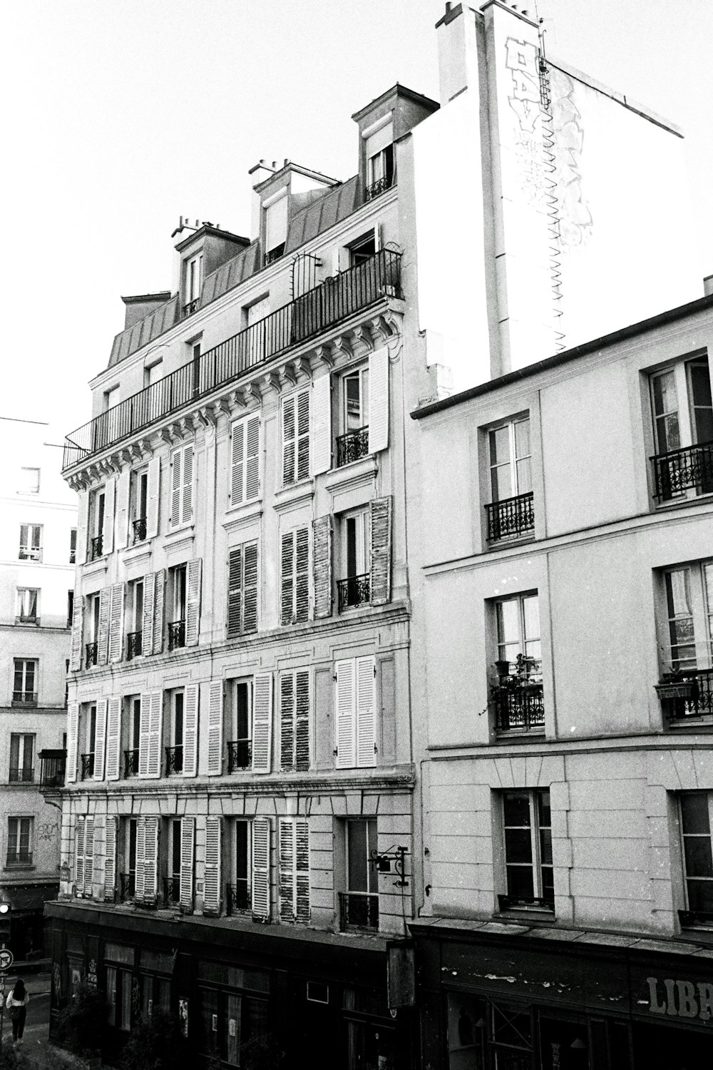 a black and white photo of a row of buildings