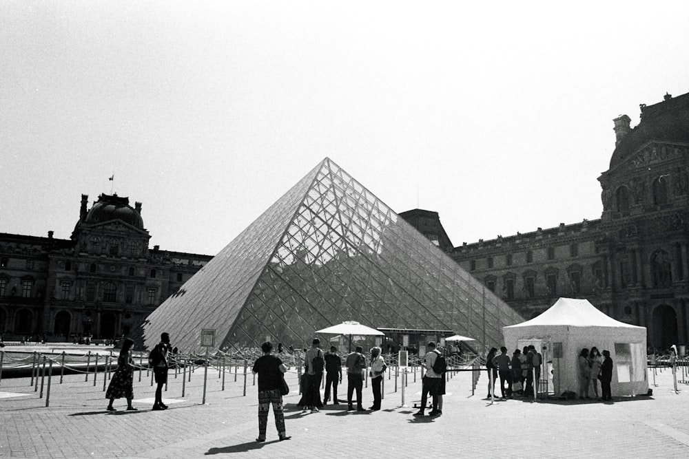 a group of people standing in front of a building