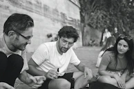 A candid moment of interaction with people, highlighting connection and sharing of knowledge.