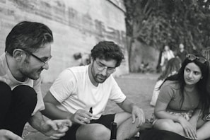 A candid moment of friends enjoying an outdoor event.