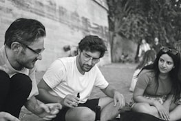 A candid shot of Pargat Singh engaging in a friendly conversation outdoors.