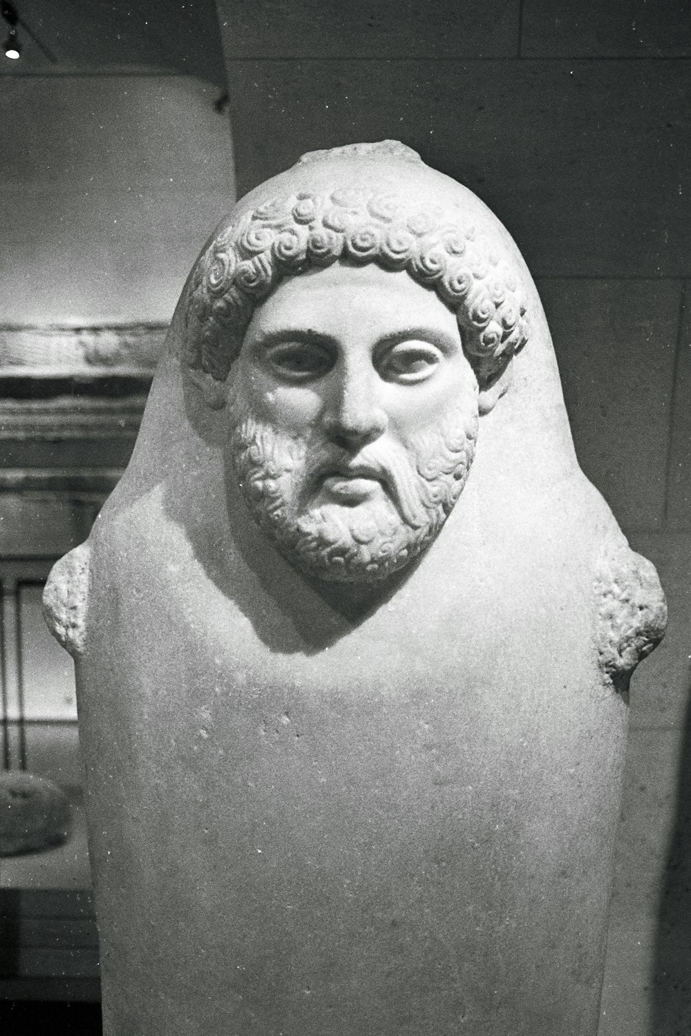 a black and white photo of a bust of a man