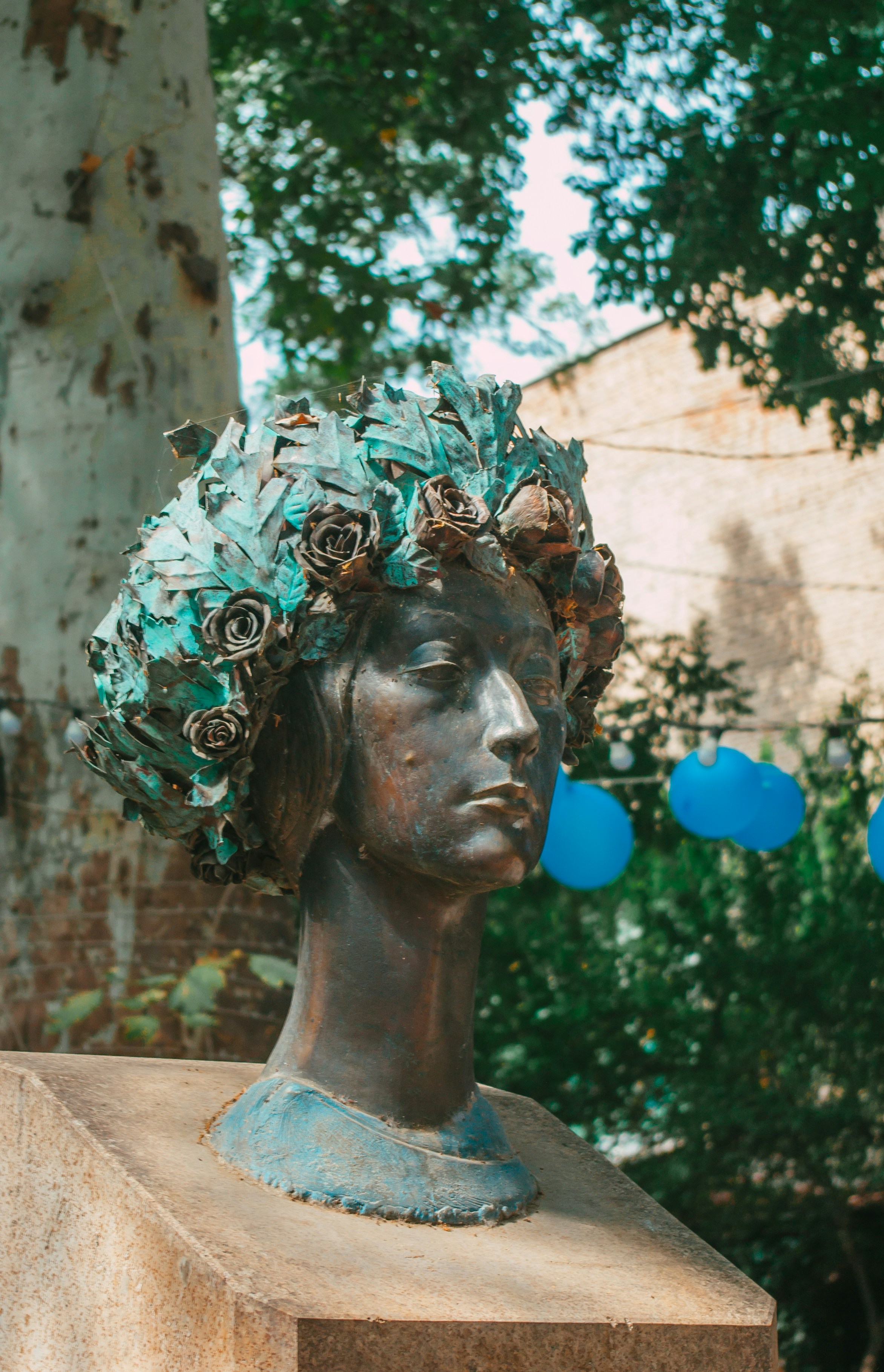 a statue of a woman with a wreath on her head