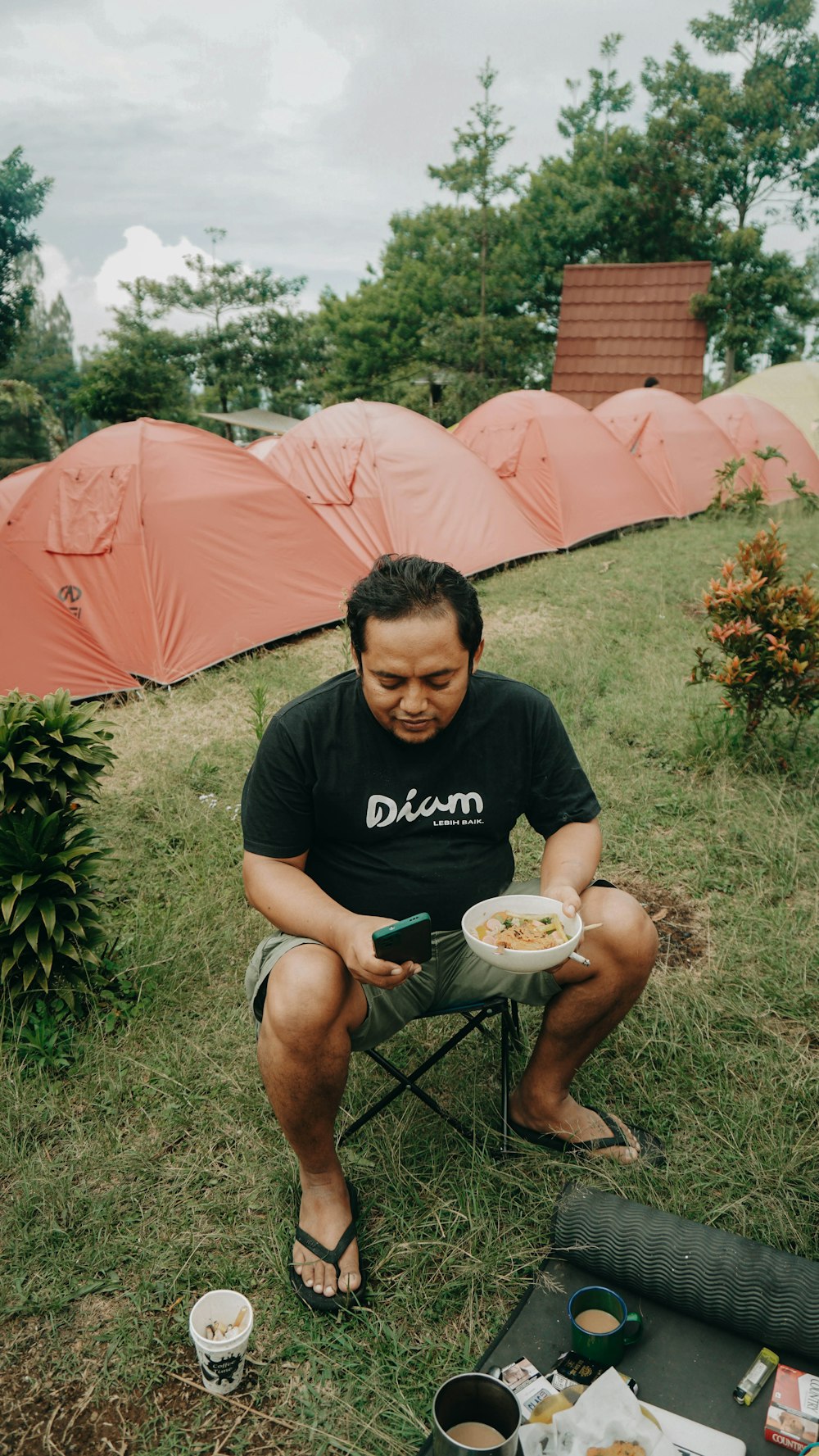 a man sitting in a chair with a plate of food