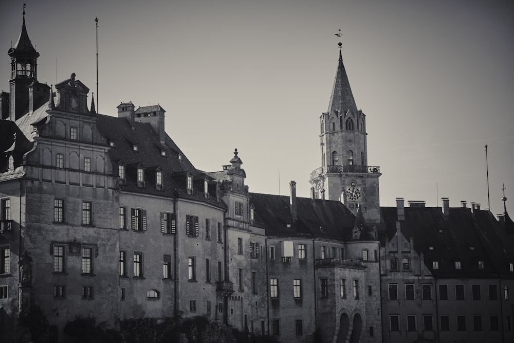 a black and white photo of a castle with a clock tower