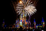 a castle is lit up with fireworks at night