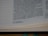 The image shows a close-up of a page from a book, specifically a biblical text. The text discusses Solomon accumulating chariots and horses. There are footnotes at the bottom of the page detailing additional information.